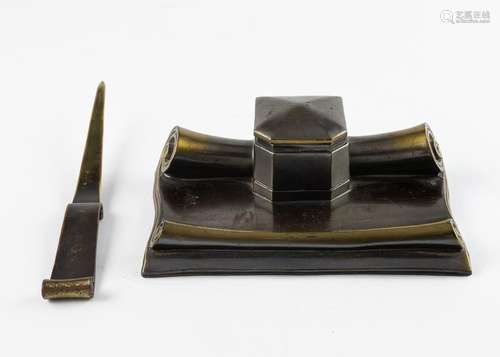 A bronze inkstand in the form of a scroll, inkwell 2 1/4 x 7...