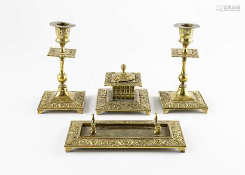 A heavily embossed brass desk set, candlestick 6 1/2 in. (16...