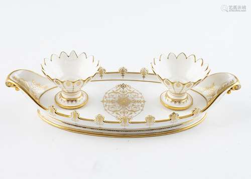 A Sevres white and gilt ink stand dish.