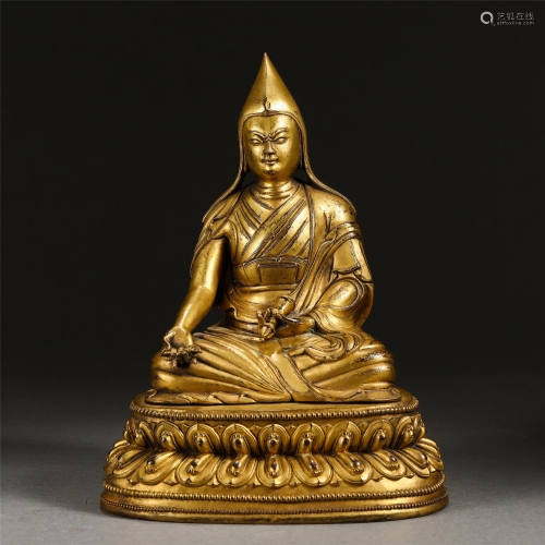 A GILT BRONZE BUDDHA SEATED BUDDHIST GURU