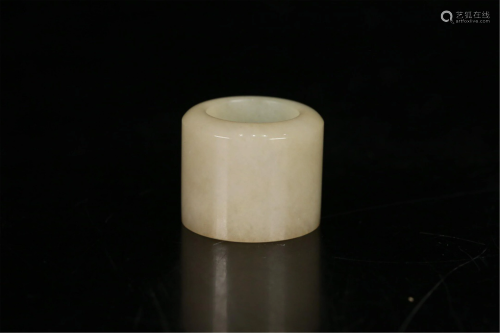 A JADEITE CARVED THUMB RING