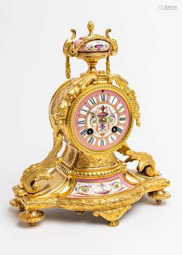 A pink porcelain and gilt metal mantel clock, 11 in. (28 cm)