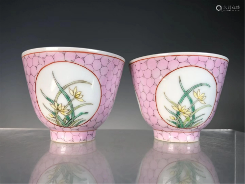 PAIR OF PINK GROUND FAMILLE ROSE FLORAL CUPS