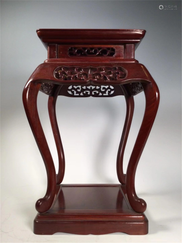 A CARVED HARDWOOD SQUARE FLOWER STAND