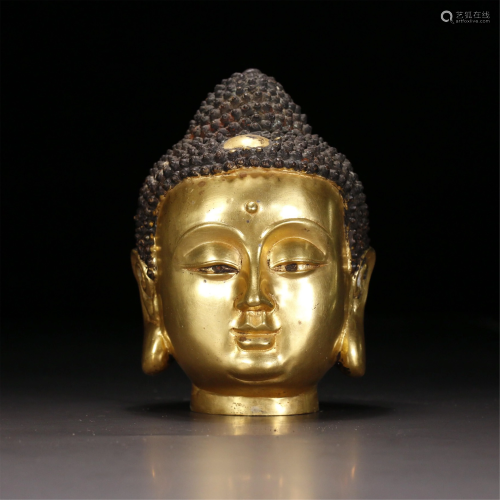 A GILT BRONZE BUDDHA HEAD STATUETTE OF SAKYAMUNI