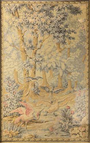 A framed tapestry depicting birds in a forest. 24 x 39 in. (...