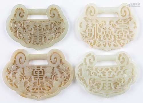 Four Chinese grey jadeite pendants of ruyi form,