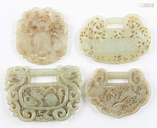 Four Chinese grey jadeite pendants in the form of ruyi,