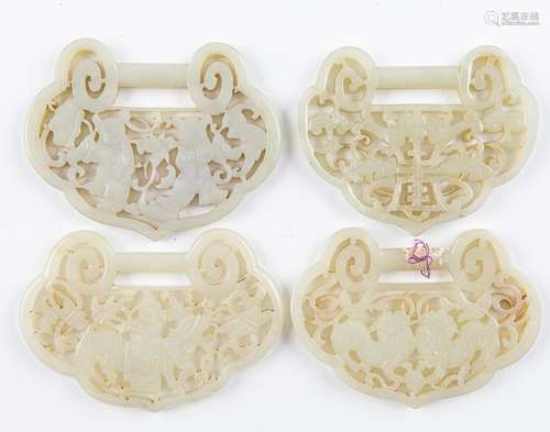 Four Chinese grey jadeite pendants of ruyi form,