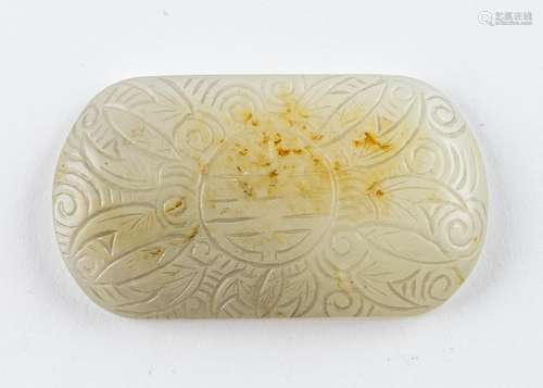 A Chinese russet and white jadeite plaque, 2 3/4 in. (7 cm)