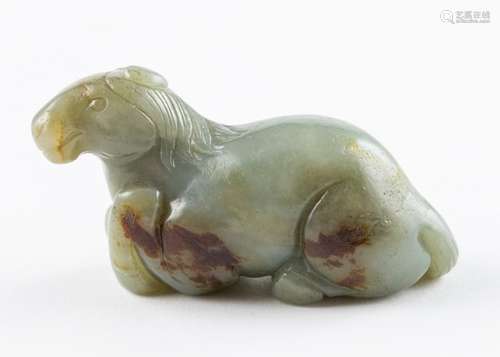 A russet and grey jadeite carving of a seated horse. 1 3/4 x...