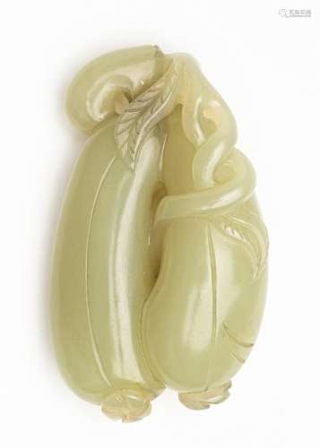 A Chinese light celadon jadeite carved pendant, 2 1/2 in. (6...