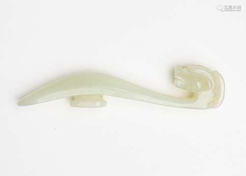 A Chinese light celadon jadeite carved belt buckle, 4 in. (1...