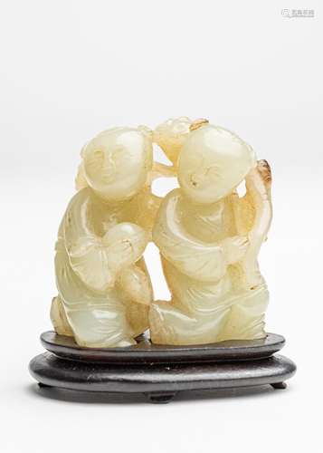 A Chinese light celadon jadeite figure of two boys, 2 in. (5...