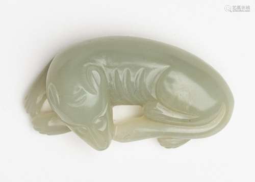 A Chinese carved celadon jadeite figure, 2 in. (5 cm)