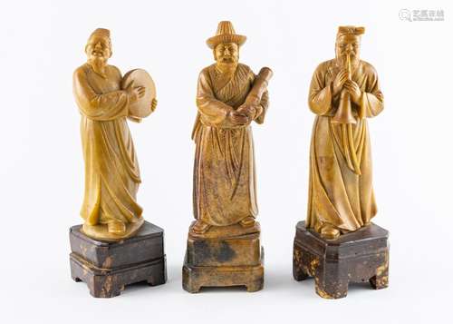 A set of three Chinese soapstone musicians, 10 in. (25.4 cm)