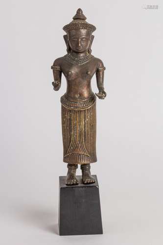 A A Thai bronze figure of a standing Buddha, 11 1/2 in. (29 ...