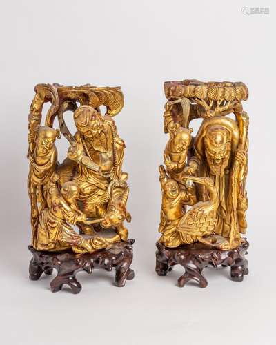 A pair of giltwood carvings, 13 1/2 in. (34 cm)