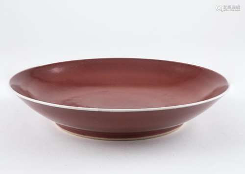 A Chinese Sang de Boeuf shallow bowl, 10 3/4 in. (27.3 cm)