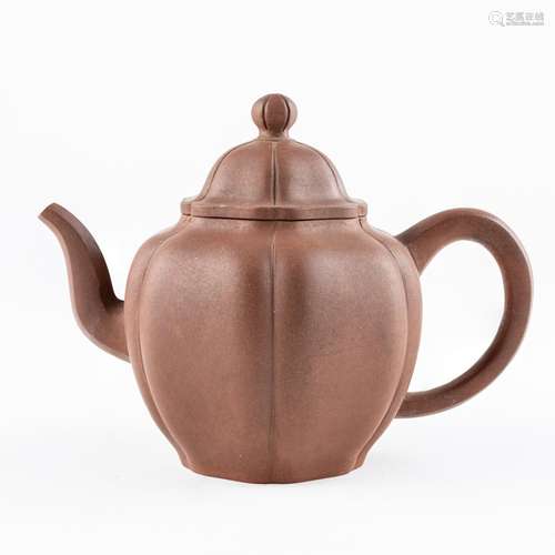 A Chinese Yixing teapot, 5 3/4 x 4 1/4 in. (14.5 x 10.7 cm)