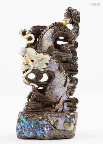 A Chinese carved opal in the form of a dragon. 6 1/4 x 2 7/8...