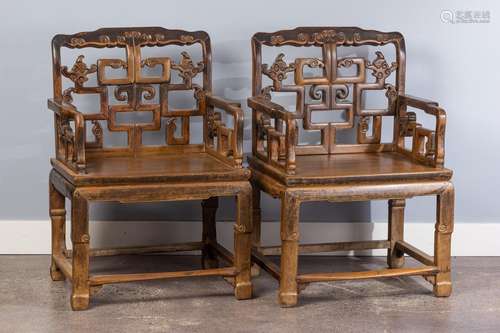 A pair of Chinese hardwood armchairs,