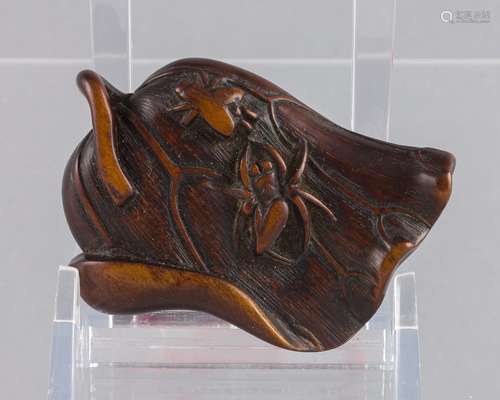 An 18th century Japanese wood netsuke, 2 x 1 7/8 x 3/4 in. (...