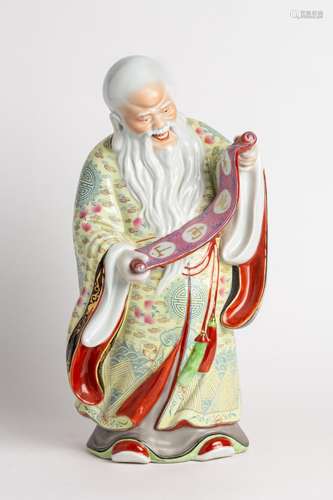 A polychrome decorated figure emblematic of longevity,