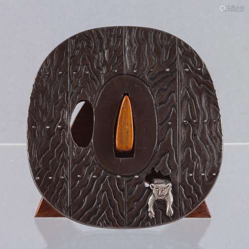 A large 19th century Japanese shibuichi tsuba, 3 1/8 x 3 in....