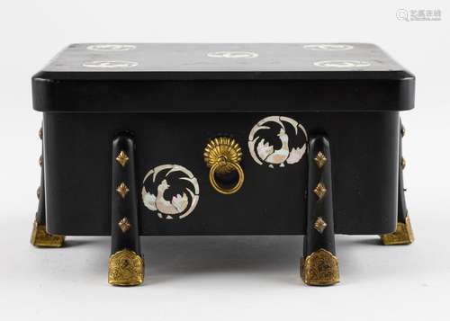 A Japanese black lacquered and mother of pearl inlaid box an...