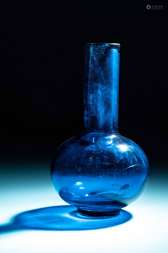 A Chinese Transparent Peacock-Blue Glass Bottle Vase