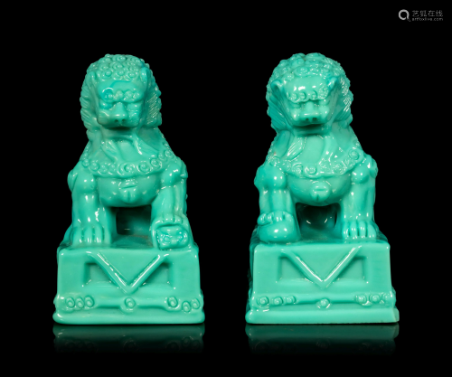 A Pair of Chinese Molded Glass Figures of Fu Lions