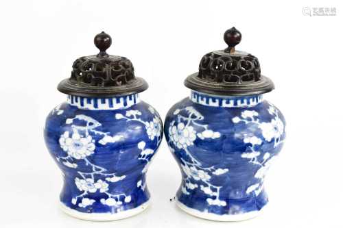 A pair of Chinese blue and white vase and covers, the body d...