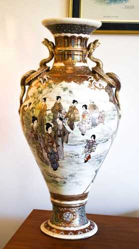 A large Chinese satsuma ware vase depicting figures in lands...