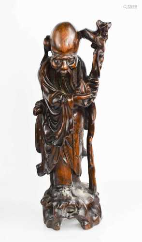 An early 20th century hardwood carved figure of Shou Lao Imm...