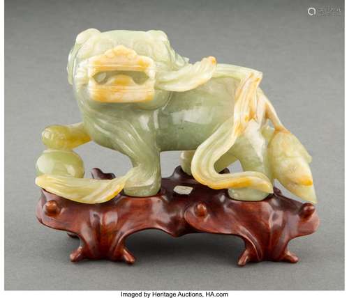 A Chinese Carved Celadon Jade Lion with Fitted Wood Stand 3-...