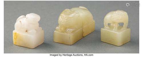 A Group of Three Chinese Carved Jade Seals 1 x 1-1/8 x 0-5/8...