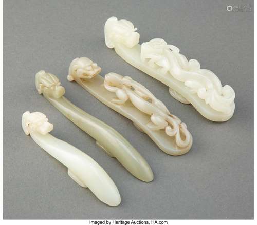 A Group of Four Chinese Carved Jade Belt Hooks 4-7/8 x 1 x 1...