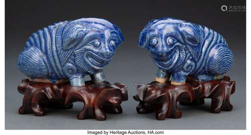 A Pair of Chinese Blue Glazed Porcelain Shi-Shi Puppies on C...