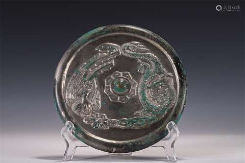 A TANG DYNASTY PHOENIX GRAIN MIRROR