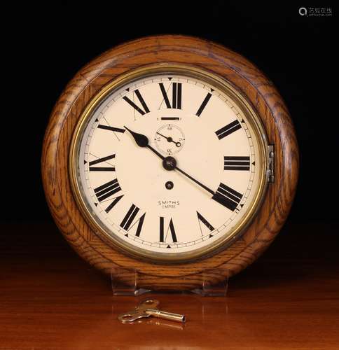 A Round Oak Cased Smiths Empire Wall Clock.