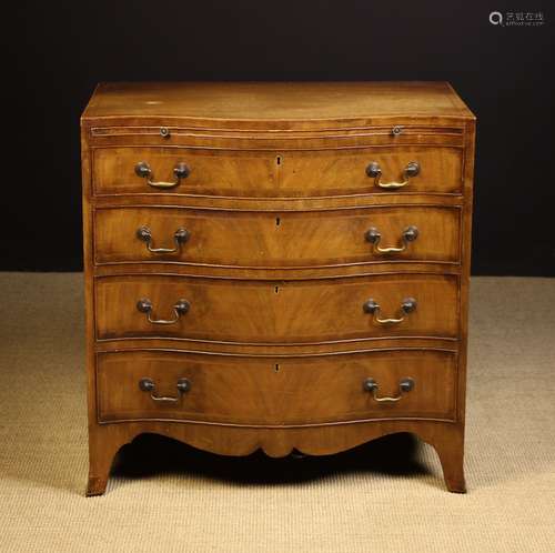 A Hepplewhite Style Mahogany Serpentine-Front Chest of Drawe...