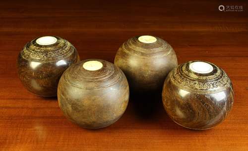 Two Pairs of Antique Lignum Bowling Balls, 4½