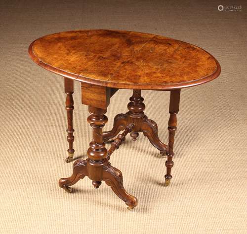 A Small Victorian Figured-Walnut Sutherland Table.