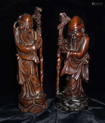 A Pair of Antique Oriental Hardwood Carvings of the Shou Xin...