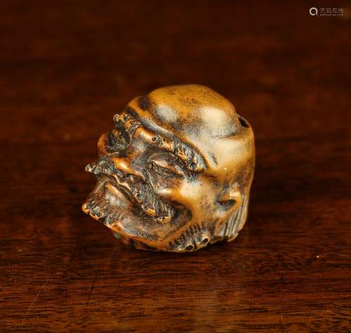 An 18th/19th Century Carved Hardwood Netsuke in the form of ...