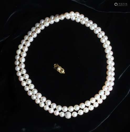 A Beautiful, Classic Mikimoto Pearl Necklace. The lustrous l...