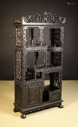 A Fine Antique Chinese Carved Ebony Standing Display Unit.