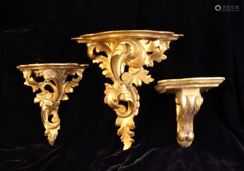 A Group of Three Carved Giltwood Wall Brackets.