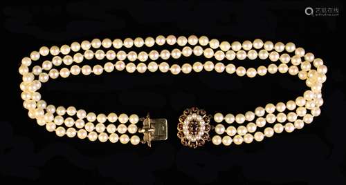 A Three Strand Pearl Choker with a 9 carat gold clasp set wi...